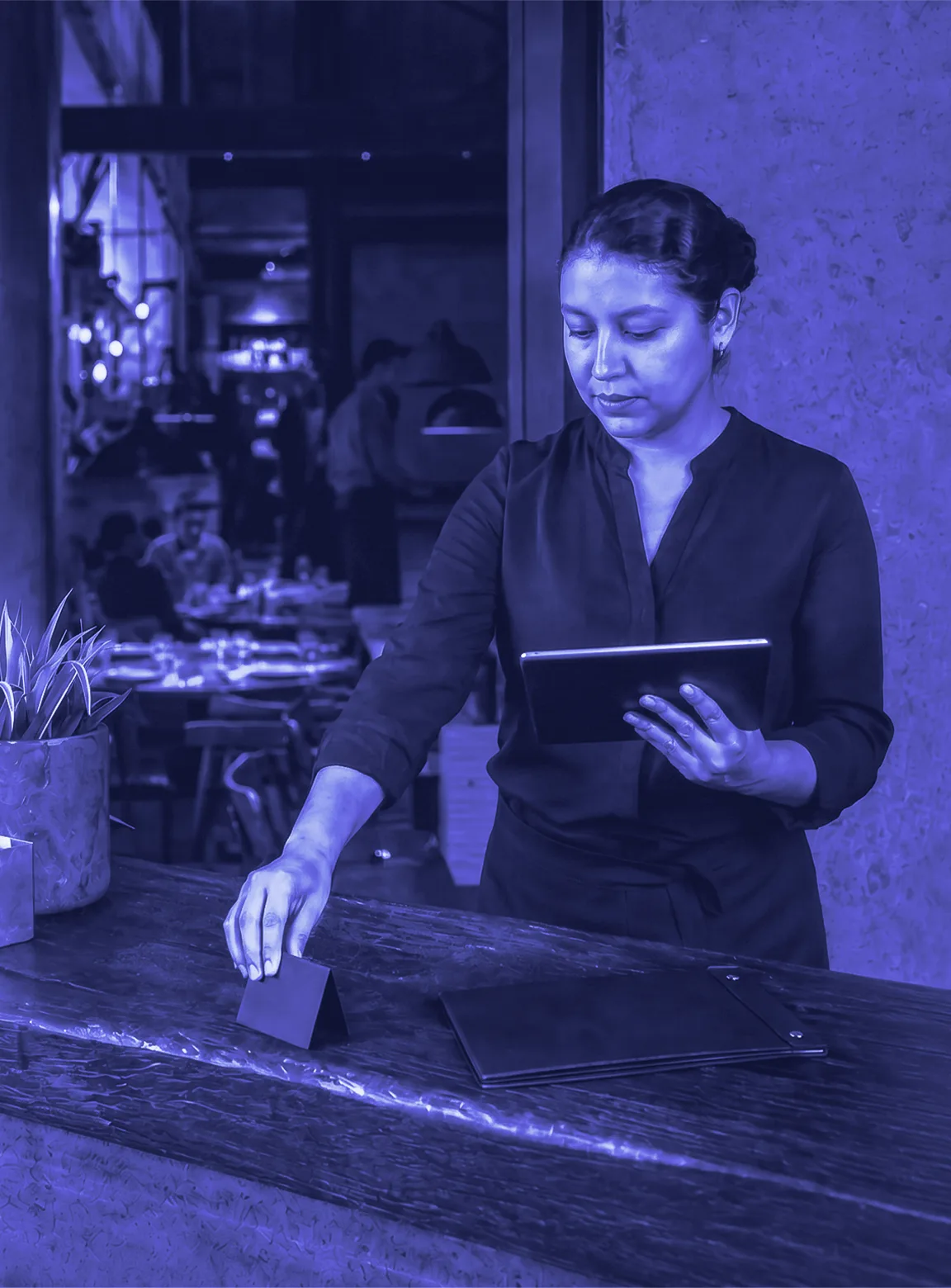 Hostess working in a dark ONYX hospitality scene